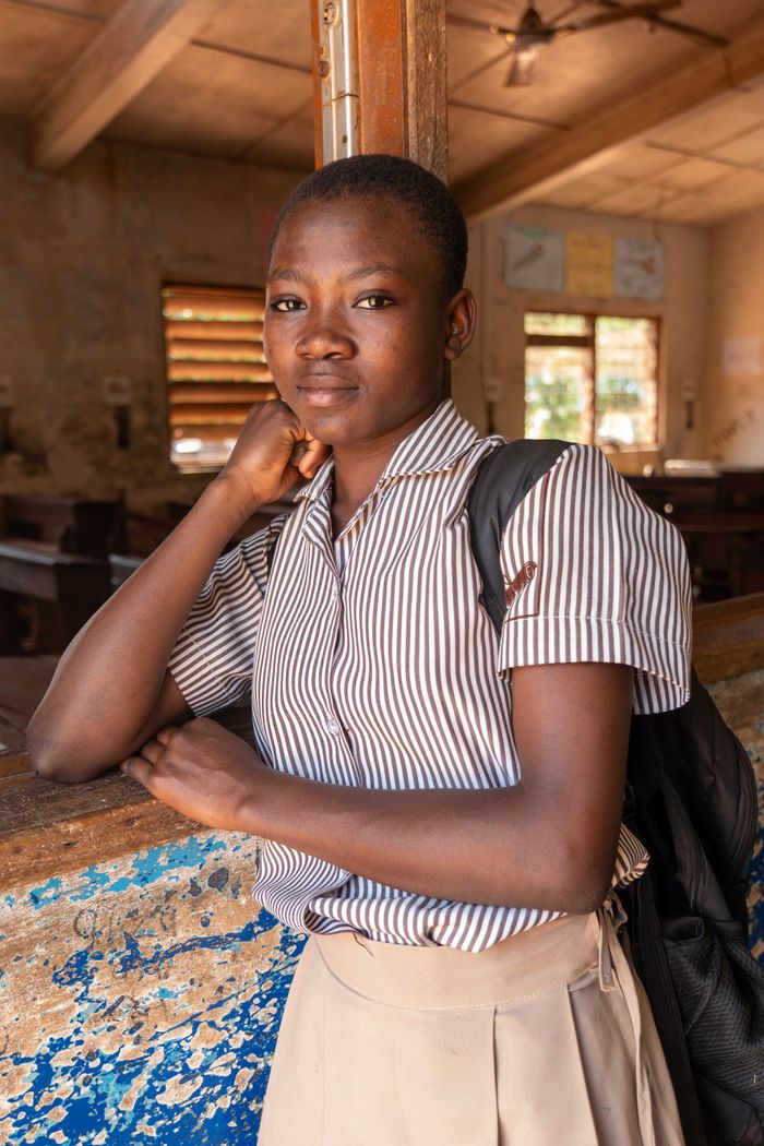 African student in a classroom, exuding confidence and readiness to learn.