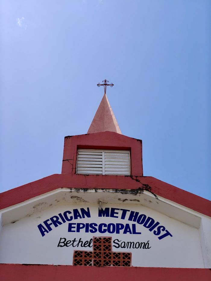 Exterior view of Bethel AME Church in Samaná, Dominican Republic under a clear blue sky.
